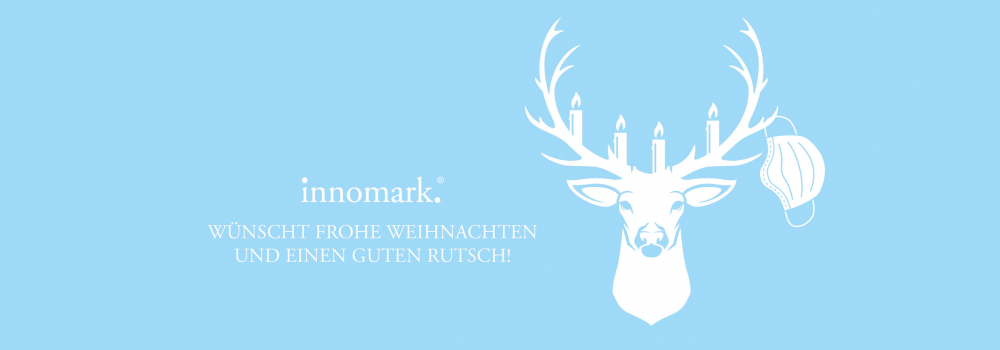 innomark Weihnachtskarte 2020 mit Hirschkopf und Maske